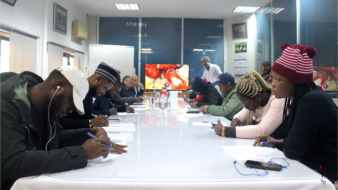 Participants receiving certificates at a Turkey Trainings graduation ceremony